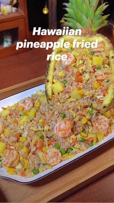 there is a pineapple on top of rice and shrimp