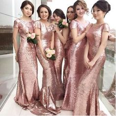 bridesmaids in pink sequin dresses posing for the camera