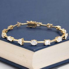 We came across a mixed cut parcel of diamonds with different shapes all around the same size - we knew we wanted to create something fun using all of them together, and so this diamond line bracelet was born! Each diamond is set in its' own basket, joined together buy gold bar links which give you a very "floating diamond" look on the wrist. She packs a big punch when worn solo but also stacks beautifully with other pieces. A fun, unique approach to the traditional diamond bracelet! 18kt yellow Modern Mens Rings, Art Jewelry Earrings, Traditional Diamond, Antique Watches, Antique Engagement, Vintage Band, Buy Gold, Gold Bar, Men's Rings