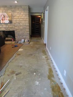 a living room that is being remodeled and filled with paint