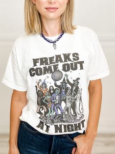 Fabric content: Graphic Tee: 100% Cotton Short Sleeve T-shirt For Night Out In Fall, Halloween Concert T-shirt With Crew Neck, Crew Neck T-shirt With Letter Print For Night Out, Graphic Cotton T-shirt For Night Out, Graphic Tee For Night Out In Fall, Halloween Graphic Tee For Concert, Graphic Tee For Fall Night Out, Cotton T-shirt For Night Out In Fall, Halloween Concert Crew Neck T-shirt