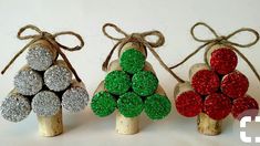 three small christmas trees made out of wine corks