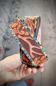 Tooled leather belt with unique southwestern designs. Features a beautiful hand painted turquoise border. The designs include a coyote, a zia, bullskull, quail, arrow, antler, and several prickly Pear Cactus.  Measures 28 inches from the bend of the belt to the middle hole. 1.5 inches wide. Southwestern Leather Belt For Rodeo, Southwestern Hand Tooled Leather Belt, Luxury Adjustable Southwestern Belt, Turquoise Belt, Southwestern Hand-tooled Adjustable Belt Buckles, Tooled Leather Belts, Southwestern Hand-tooled Brown Belt Buckles, Cowgirl Accessories, Prickly Pear Cactus