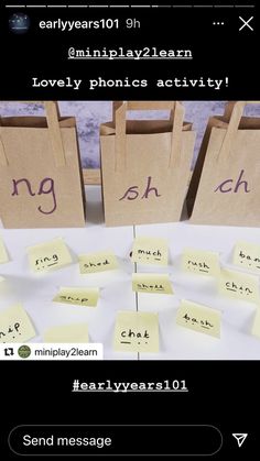 several small bags with writing on them and some sticky notes in front of them that spell out words