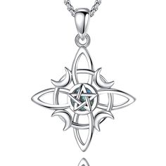 a silver pendant with an intricate design