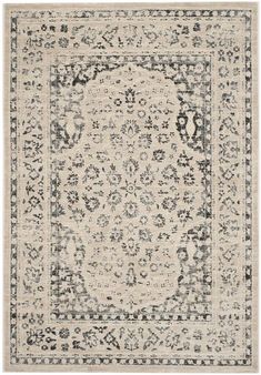 an area rug with black and white designs on the bottom, in shades of gray