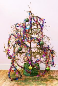 a small christmas tree with ornaments on it