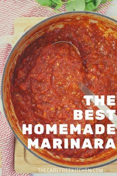 the best homemade marinara sauce in a pot with a wooden spatula on top