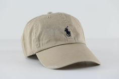 POLO RALPH LAUREN  SIGNATURE PONY HAT with Pony Logo & Adjustable Strap  "This classic baseball cap is crafted from durable washed cotton twill and finished with POLO RALPH LAUREN signature pony embroidery."   NUBUCK with Dark Navy Pony Logo BRAND NEW WITH TAGS   MSRP $45.00 Detail Description               Embroidered ventilating grommets. Contrasting bill underside.          Adjustable slider buckle at the back.          POLO RL signature embroidered pony accents the front.   One size. Dark Navy, Cotton Twill, Polo Ralph, Baseball Cap, Caps Hats, Accessories Hats, Baseball Hats, Adjustable Straps, Polo Ralph Lauren