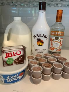 the ingredients to make an ice cream dessert are displayed on a counter top next to a jug of milk