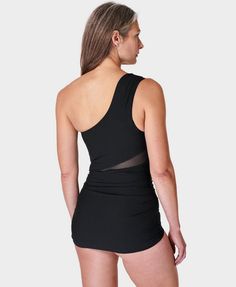 Our ultra-flattering new swimsuit with an asymmetric silhouette. Part-recycled, super-sculpting fabric is double layered for increased support. Feminine shape with ruching, mesh inserts and medium cut legs. Resistant to damage from chlorine . In-built bra support and padding. Centre front length: 65.5cm / 26”. Model wears size S and is 178cm/5'10" tall. Style Code: SB9631Colour: Black Bra Support, Swimsuits Bikinis, Medium Cut, Running Leggings, Yoga Shop, Sweaty Betty, Support Bras, Black Swimsuit, Ski Wear