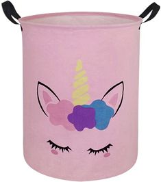 a pink trash can with a unicorn's face painted on it