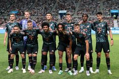 a group of soccer players pose for a team photo