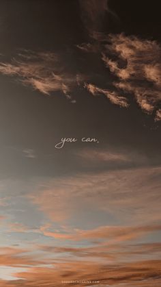 an airplane is flying in the sky with writing on it's side and clouds above