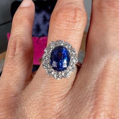 Centering an Oval Modified Sapphire weighing approx. 5.04ct., framed by twelve Old Mine cut diamonds weighing approx. 1.15ctw, fashioned in platinum. Size 6 1/4. AGL-GB44819 ______ At Doyle & Doyle, jewelry is as sustainable as it is beautiful. Our vintage and antique jewelry is innately ethical and conflict-free as it does not involve any new mining or negative environmental impact. We are proud that our in-house jewelry line Heirloom by Doyle & Doyle is made exclusively for us by our team of e Ruby Diamond Rings, Vintage Sapphire, Emerald Diamond Ring, Cameo Brooch, Sapphire Diamond Ring, Ruby Diamond, Fine Rings, Contemporary Jewelry, Emerald Diamond