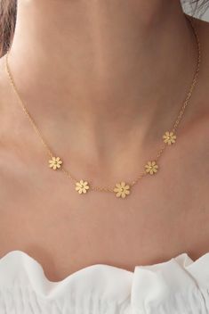 "High-quality gold plated stainless steel flower necklace for women, flower jewelry, dainty necklace, delicate jewelry, girlfriend necklace ✨ Stop worrying about your jewelry being tarnished, discolored, rusted, or scratched with 316L stainless steel.  ✨ The necklace is entirely made of 316L high-quality stainless steel, which makes it more durable in harsh conditions (swimming, showering, and chemical contact). ✨ 316L steel is naturally anti-allergenic, so it won't cause any allergy. ✨ The stainless steel mark is sealed as s-steel on the necklace. ✨ 316L is better than silver and feels like gold; therefore will make a perfect gift for you and your loved ones. ✨ 100% satisfaction guarantee; Return it within 14 days if you feel unsatisfied. ✨ Please don't hesitate to get in touch with me wi Cheap Gold Flower Necklace For Party, Cheap Dainty Flower Necklace For Gift, Cheap Dainty Gold Flower Necklace, Delicate Chain Charm Necklace With Flower Pendant, Feminine Flower Pendant Necklace With Clavicle Chain, Dainty Yellow Gold Stainless Steel Necklaces, Yellow Gold Flower Charm Necklace, Dainty Yellow Gold Stainless Steel Necklace, Dainty Rose Gold Flower Necklace With Delicate Chain