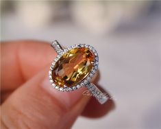 Gorgeous 8*12 mm  oval Citrine ring, made with 925 sterling silver, plated with white gold.Main Stone: 8*12 mm Natural CitrineSide Stone: CZNeed other size please contact.CS0100 Yellow Oval Topaz Ring With Halo Setting, Oval Orange Topaz Ring With Center Stone, Oval Orange Topaz Gemstone Ring, Orange Oval Topaz Rings, Oval Orange Rings With Accent Stones, Orange Oval Rings With Accent Stones, Yellow Citrine Engagement Ring, Pear Sapphire Ring, Citrine Engagement Ring