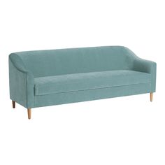 a blue couch sitting on top of a white floor