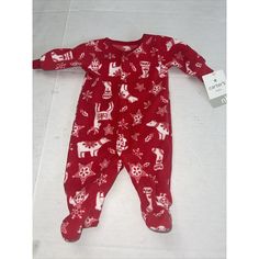 Get Your Little One Into The Festive Spirit With This Adorable Carter's Santa Claus Themed Footed Sleeper. Made From A Cozy Cotton Blend Fleece Material, This Long Sleeve Sleeper Features Snaps For Easy Closure And Is Perfect For The Winter And Fall Seasons. The Bright Red Color With White Accents Is Perfect For Christmas And The Santa Claus Character Adds An Extra Touch Of Holiday Cheer. Available In Newborn Size, This One-Piece Sleeper Is A Must-Have For Any Baby's Sleepwear Collection. Red Onesie For Playtime In Winter, Red Onesie For Winter Holiday, Red Holiday Onesie For Winter, Red Winter Onesie For Playtime, Red Long Sleeve Cotton Onesie, Red Cotton Long Sleeve Onesie, Newborn Christmas Pajamas, Red Cotton Holiday Onesie, Playful Red Bedtime Onesie