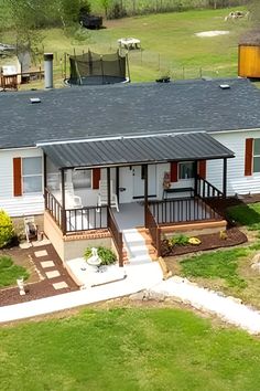 an aerial view of a small white house