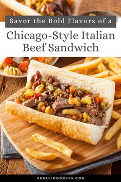 the chicago style italian beef sandwich on a cutting board with french fries