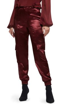 Luxurious textured satin lends a glam look to military-inspired cargo trousers fashioned in a slim silhouette with multiple flap pockets. Smocked cuffs 58% polyester, 42% recycled polyester Hand wash, dry flat Imported This product meets Nordstrom Sustainably Sourced Materials criteria: contains at least 30% sustainably sourced materials Casual Cargo Pants With Pockets For Party, Chic Fall Cargo Parachute Pants, Chic Fall Cargo Style Parachute Pants, Chic Cargo Style Parachute Pants, High-waisted Cargo Pants For Night Out, Fitted Parachute Pants With Pockets For Night Out, Trendy Party Cargo Pants With Pockets, Chic Fall Cargo Pants With Multiple Pockets, Trendy Cargo Pants With Pockets For Party