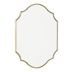 a gold framed mirror on a white wall with a black border around the edge and an oval