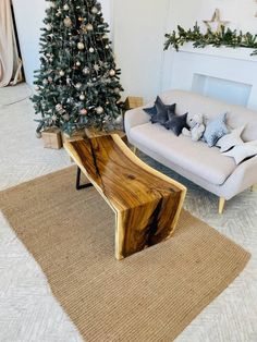 a living room filled with furniture and a christmas tree