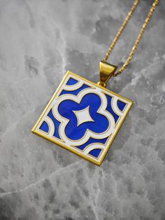 I always loved the patterns that are used in ceramic tiles. I often apply them on my jewelry pieces. I chose a flower tile pattern and I wanted to use bright colors. The enamel colors in this necklace is  transparent dark blue and ancient white. The whole necklace is 925 Sterling Silver and it has 18k gold plating.If you want me to use different enamel colors and want to customize your necklace, please contact me by messaging the shop. Thank you for reading. Elegant Enamel Inlay Necklaces, Flower Tile Pattern, Antique Engraved Enamel Necklace, Collectible Silver Enamel Necklace, Antique Silver Enamel Necklace, Vintage Blue Enamel Necklace, Enamel Necklaces, White Enamel, Gold Plated Silver