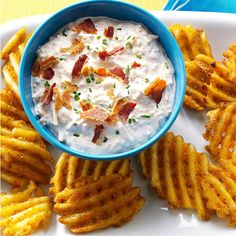 potato chips with bacon dip in a blue bowl