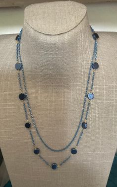 Two strand necklace in blue and gold. One strand is just chain the second has blue pyrite coins. Elegant Blue Delicate Chain Necklace, Elegant Blue Long Chain Necklace, Elegant Long Blue Chain Necklace, Elegant Blue Beaded Chain Necklace, Elegant Blue Chain Necklace For Party, Elegant Blue Beaded Necklace With Adjustable Chain, Blue Long Necklace For Party, Blue Long Necklace With Adjustable Chain, Elegant Blue Metal Chain Necklace