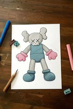 a drawing of a teddy bear with pink gloves and blue overalls next to colored crayons