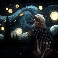 a man standing in front of a painting with stars and swirls on the background