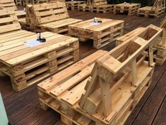 wooden pallets are arranged on the deck to be used as seating for an event