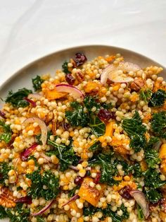 a white plate topped with corn and vegetables