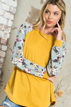 Pretty blooms pop on the raglan sleeves of a top that you'll want to pair with everything. Material: 87% polyester 10% rayon 3% spandex Stretch: Slightly stretchy Care: Machine wash cold, gentle cycle, do not bleach, tumble dry low. Made in USA Product Measurements S: 36.0-38.0” (Bust) M: 38.0-40.0” (Bust) L: 40.0-42.0” (Bust) Stretch Cotton Floral Print Tops, Stretch Cotton Tops With Floral Print, Casual Fitted Raglan Sleeve Tops, Long Sleeve Tops With Contrast Sleeves For Fall, Casual Fitted Tops With Raglan Sleeves, Casual Fitted Top With Raglan Sleeves, Fitted Casual Top With Raglan Sleeves, Fall Long Sleeve Tops With Contrast Sleeves, Floral Print Stretch Crew Neck Top