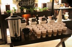 coffee cups are lined up on a table