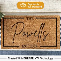 a door mat with the words, the powells and an image of a plant on it