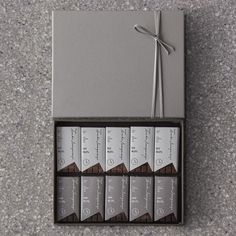 six chocolate bars in a box tied with a string