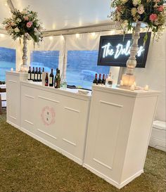 the bar is decorated with flowers and candles