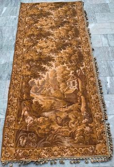 an antique rug is laying on the floor