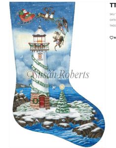 a christmas stocking with santa's sleigh flying over a lighthouse