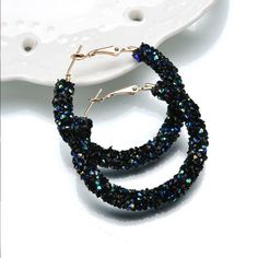 A fun update to the timeless bold hoop earrings. Completely encrusted in a sparkly crystal tube, available in three color options: black, iridescent black (with a blue-green shine) and opalescent white. Material: Alloy/Crystals Size: 4.5m (1.75 inches) Comes in gift boxed. Earrings Punk, Big Jewelry, Lady Girl, Crystal Hoop Earrings, Round Circle, Beaded Hoop Earrings, Big Earrings, Women Party, Rhinestone Jewelry