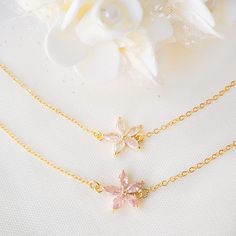 This personalized bridesmaid delicate bracelet is made with gold plated chain and blush color zircon flower charm. These zircon flowers emit a mesmerizing light under the light, giving people dazzling visual effects. Charm size: 1.5x1.3cm Bracelet length is 7" (17.5cm) plus a 3cm extended chain  (if you want other length, please contact me, it is free).  These bracelets will come in boxes with personalized name cards. If you wish, I can add an initial disc to the bracelet. There is also a flower Personalized Gold Bracelet, Gold Flower Bracelet, Flower Girl Bracelets, Girl Bracelet, Bracelet Flower, Personalized Bridesmaid Gifts, Wedding Jewelry Bracelets, Bridesmaids Personalized, Flower Bracelet