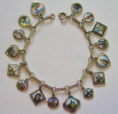 IT HAS 16 CHARMS ATTACHED TO A SINGLE LINK BRACELET. IT IS SO MUCH LOVELIER IN REAL THAN IT SHOWS IN THE PICTURES WITH VERY VIBRANT COLORS. THE LAST PICTURE SHOWS OUR LADY OF MARIA ZELL AND THE BASILICA. Cockle Shells, Travel Charm Bracelet, Teen Jewelry, Travel Charms, The Last Picture Show, Vintage Souvenir, Magpie, Silver Enamel, Pilgrimage