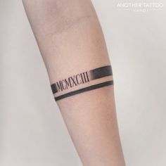 a woman's arm with a tattoo that reads, momxcui on it