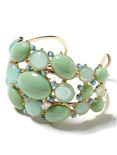 Cabochon cuff Chic Green Jewelry For Spring, Chic Green Spring Jewelry, Chic Spring Bangle Jewelry, Elegant Oval Cabochon Cuff Bracelet, Trendy Cuff Jewelry For Spring, Elegant Adjustable Stones Bangle, Elegant Adjustable Bangle With Stones, Elegant Green Cuff Bracelet For Formal Occasions, Elegant Spring Bangle