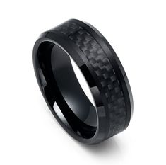 black ceramic ring with carbon fiber inlaying the center and an intricate pattern on it