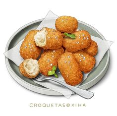 a plate full of croquettass and biscuits with a fork on the side