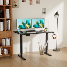 two computer monitors sitting on top of a wooden desk in front of a bookshelf